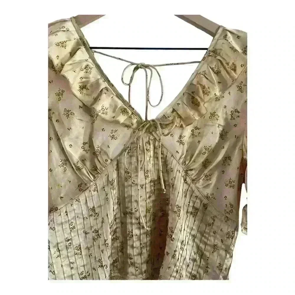 FREE PEOPLE Isabella Silky Floral Ruffle Babydoll Blouse in Copper‎ color